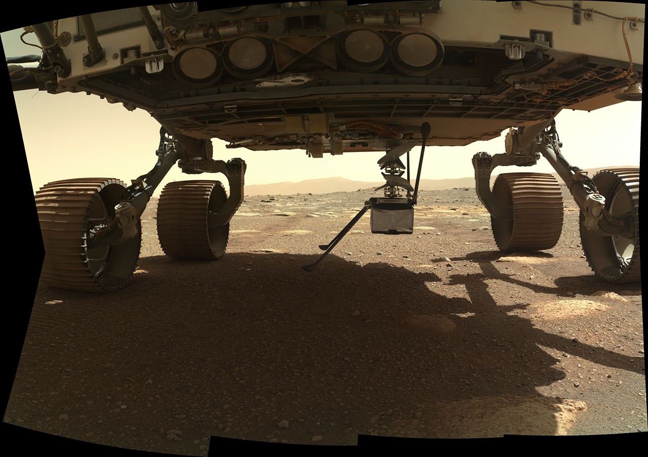 After flight 72, Ingenuity photographs the shadow of a rotor blade damaged on landing. NASA/JPL-Caltech, PIA26243.