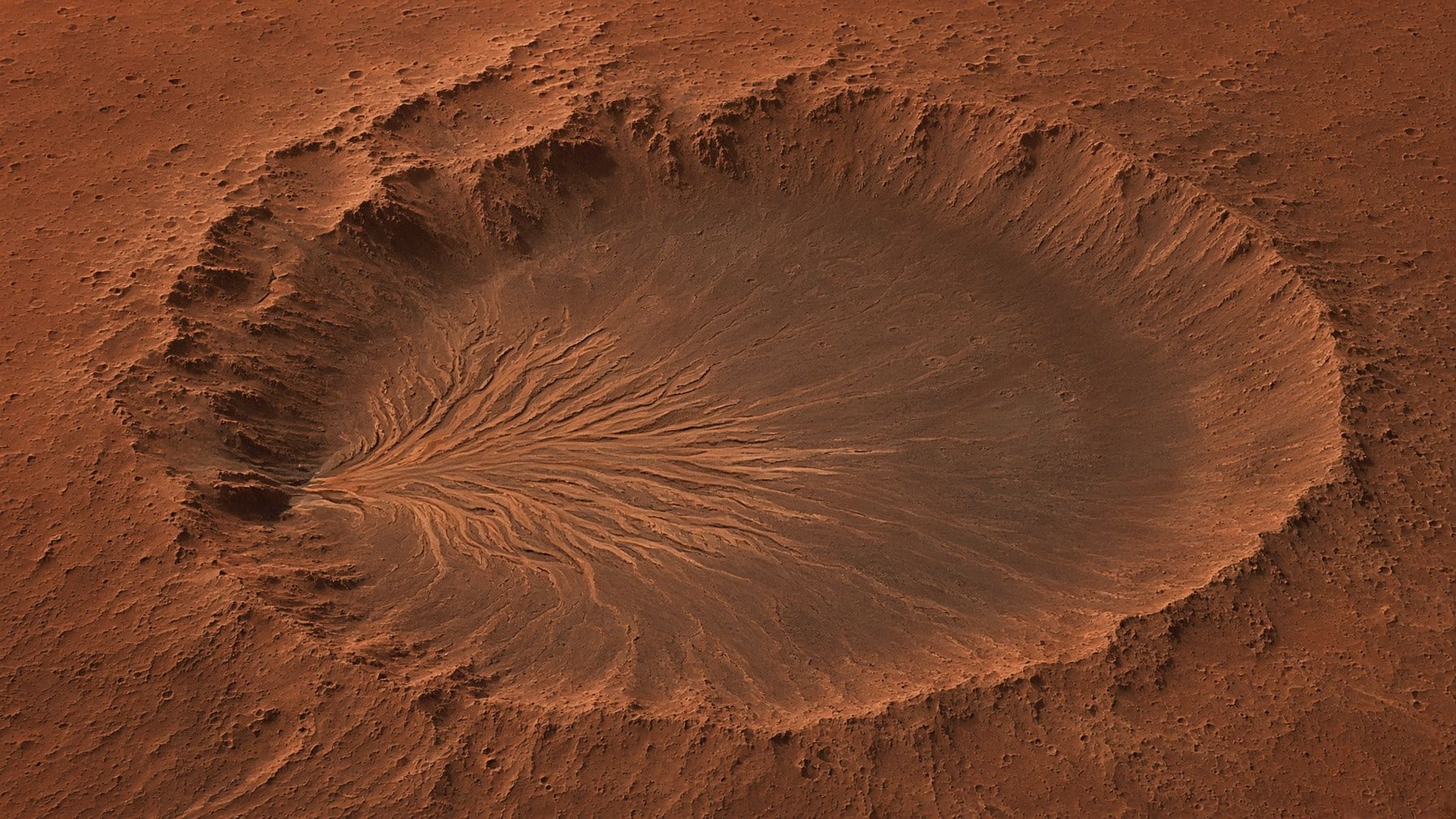 Jezero crater’s ancient river delta, layered sediment fans on the crater floor.